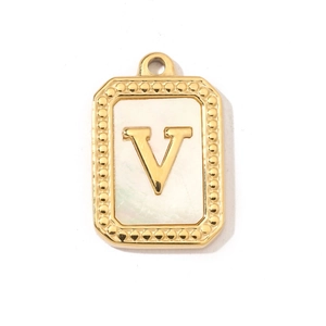 Macro detail of gold letter V pendant with shell inlay and beaded rectangular border