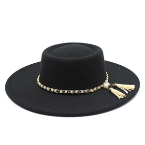Detail of wool felt boater hat featuring a gold chain with pearls and white tassels