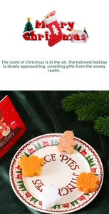 Detailed view of gingerbread man and Santa scented candles on a festive velvet background