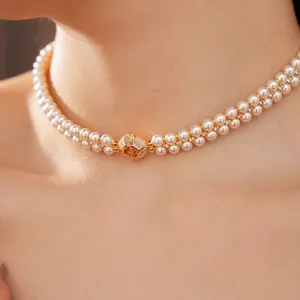 Collier ras du cou double rangée de perles avec pendentif zircon doré élégant