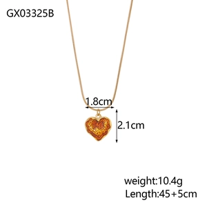Detail showing amber resin heart pendant size 1.8cm x 2.1cm with golden chain specs