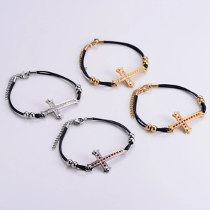 Matching couple cross bracelets with adjustable cords and rhinestone accents