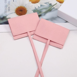 Pink microfiber suede jewelry pouches with elegant envelope flap and tie ribbon closure