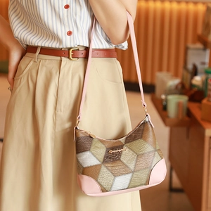 Retro patchwork underarm bag with geometric textures and stylish pink shoulder strap