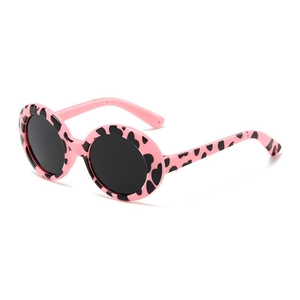 Detailed view of round dark lenses and pink cow print frames on pet sunglasses