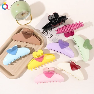 Collection of heart-shaped hair claw clips in various pastel and vibrant colors