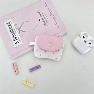 Pink star print fabric storage pouch for wireless earbuds with a heart-shaped closure