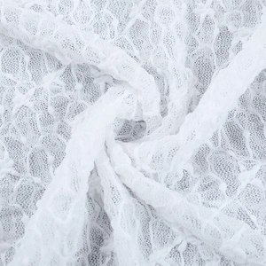 Macro de tela de encaje floral blanco de alta calidad con texturas de costura fina