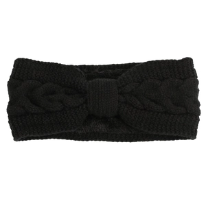 Close-up of black cable knit headband with bow design and warm fleece lining texture