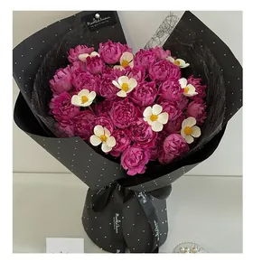 Detail of luxury flower wrapping paper with sparkling glitter rhinestones and polka dots