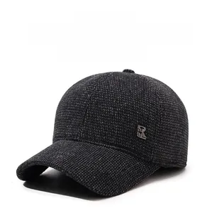 Detailed close-up of dark grey wool baseball cap featuring ear flaps and SR metal logo