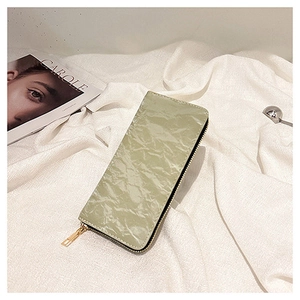 Close-up of olive green long zipper wallet featuring elegant pleated leather texture