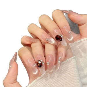 Luxury long almond press-on nails with red rhinestones, pearls and cat-eye finish