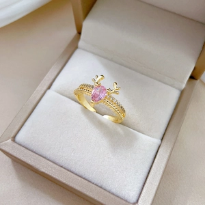 Adjustable golden deer antler ring with pink gemstone and pave diamonds in gift box