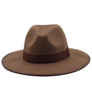 Detail of coffee brown fedora with grosgrain ribbon and leather-bound brim edge