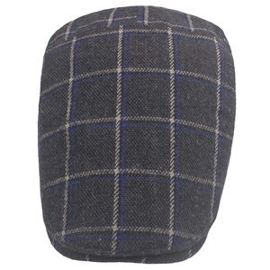 Detailed close-up showing the textured grey and blue plaid pattern of the wool flat cap