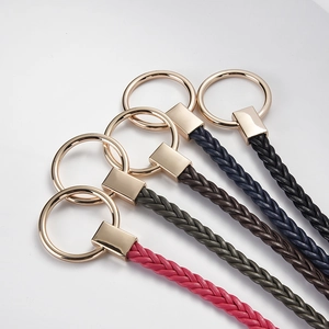 Braided leather keychains in five colors with premium gold metal rings on a clean gray base