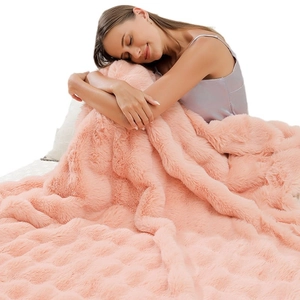 Fluffy pink faux fur blanket made of soft bubble plush for sofa and home comfort