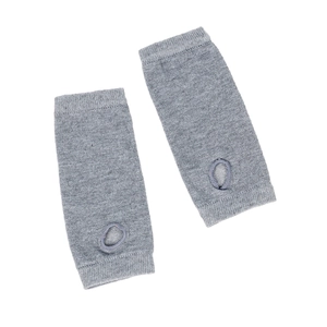 Close-up of grey knitted arm sleeves with thumb hole detail and striped texture