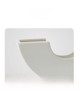 Detailed close-up of handmade matte white ceramic vase showing refined sandy texture