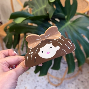 Cute brown-haired girl acetate hair claw clip with beige bow hair accessory for women