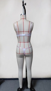 Rear view of pink and white lace lingerie set with adjustable straps and G-string on mannequin