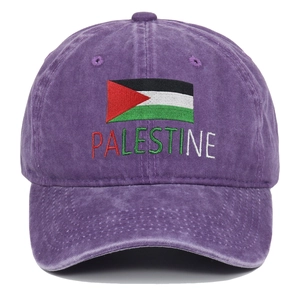 Close-up of Palestine flag embroidery and text on washed purple baseball cap