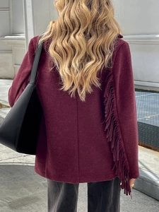 Detailed back view of a burgundy jacket for women featuring elegant fringe tassel design
