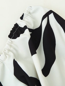 Detailed macro view of black and white print fabric with elastic pleated stitching detail