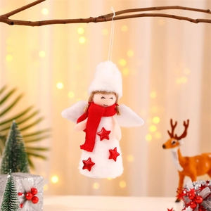 White plush Christmas angel ornament with wings and red scarf on a decorated tree