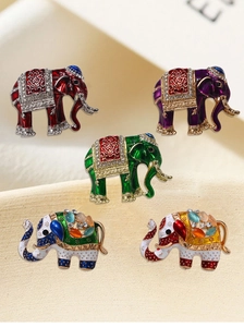 Detail of five vintage colorful elephant brooches with enamel finish and crystals