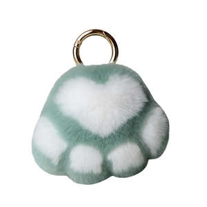 Plush Rex rabbit fur kitten paw keychain with teal and white fur and gold metal clasp
