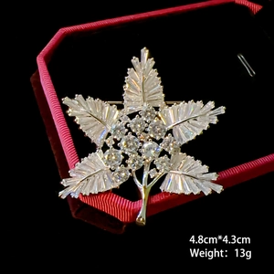 Sparkling snowflake brooch with crystals in red jewelry box, size 4.8cm by 4.3cm