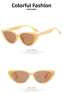 Detail view of cream cat-eye sunglasses featuring jelly tea-colored lenses and frames