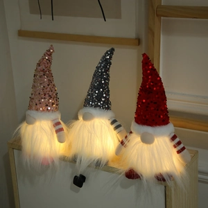 Three glowing Christmas gnomes with pink, grey, and red sequin hats for home decor
