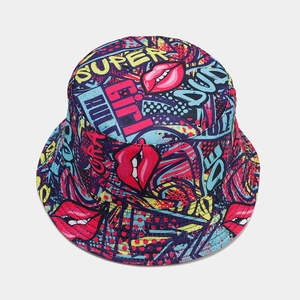 Close-up of reversible bucket hat with colorful pop art graffiti and red lip prints