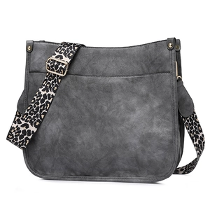 Detail view of the gray PU leather tote bag featuring a trendy leopard print shoulder strap