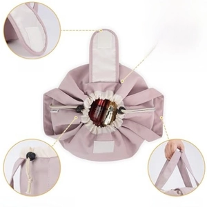 Pink waterproof drawstring makeup bag with dual handles and secure velcro closure system