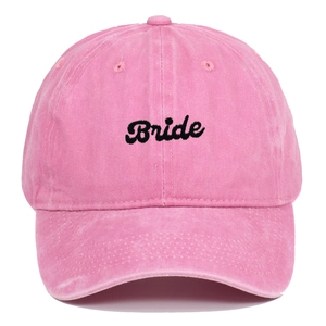 Detailed embroidery of black Bride text on a pink washed cotton baseball cap