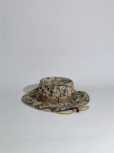 Close-up of camouflage boonie hat with digital pattern, wide brim and adjustable chin cord