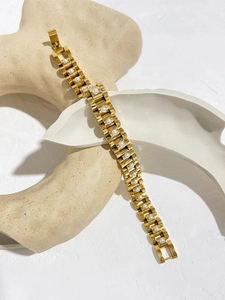 Close-up of 18K gold-plated stainless steel watchband bracelet with white pearl accents