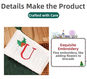 Detail of green knit Christmas stocking with red embroidered letter U and holly berry