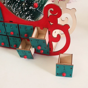 Wooden Christmas sleigh countdown calendar with small drawers and festive berry tree