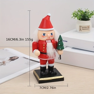 Classic red wooden Santa Claus nutcracker ornament on a wooden desk for Christmas decor