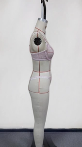 Detailed side view of light pink floral lace lingerie set with sheer embroidery details