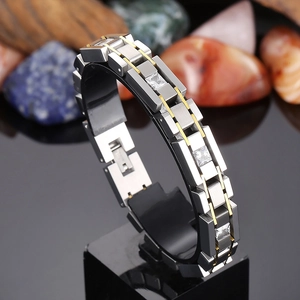 Men's two-tone stainless steel bracelet with square cubic zirconia on black stand