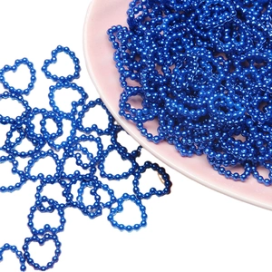Blue heart-shaped ABS pearl beads string for DIY crafts in a pink ceramic bowl
