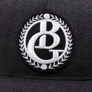 Flat brim hip-hop cap in dark grey twill fabric featuring circular BG embroidery logo