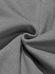 Close-up of soft dark grey fleece fabric texture with detailed knit grain for sweatshirts