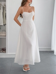 Detail of white cotton linen blend maxi dress with slim fit bodice and flared A-line skirt